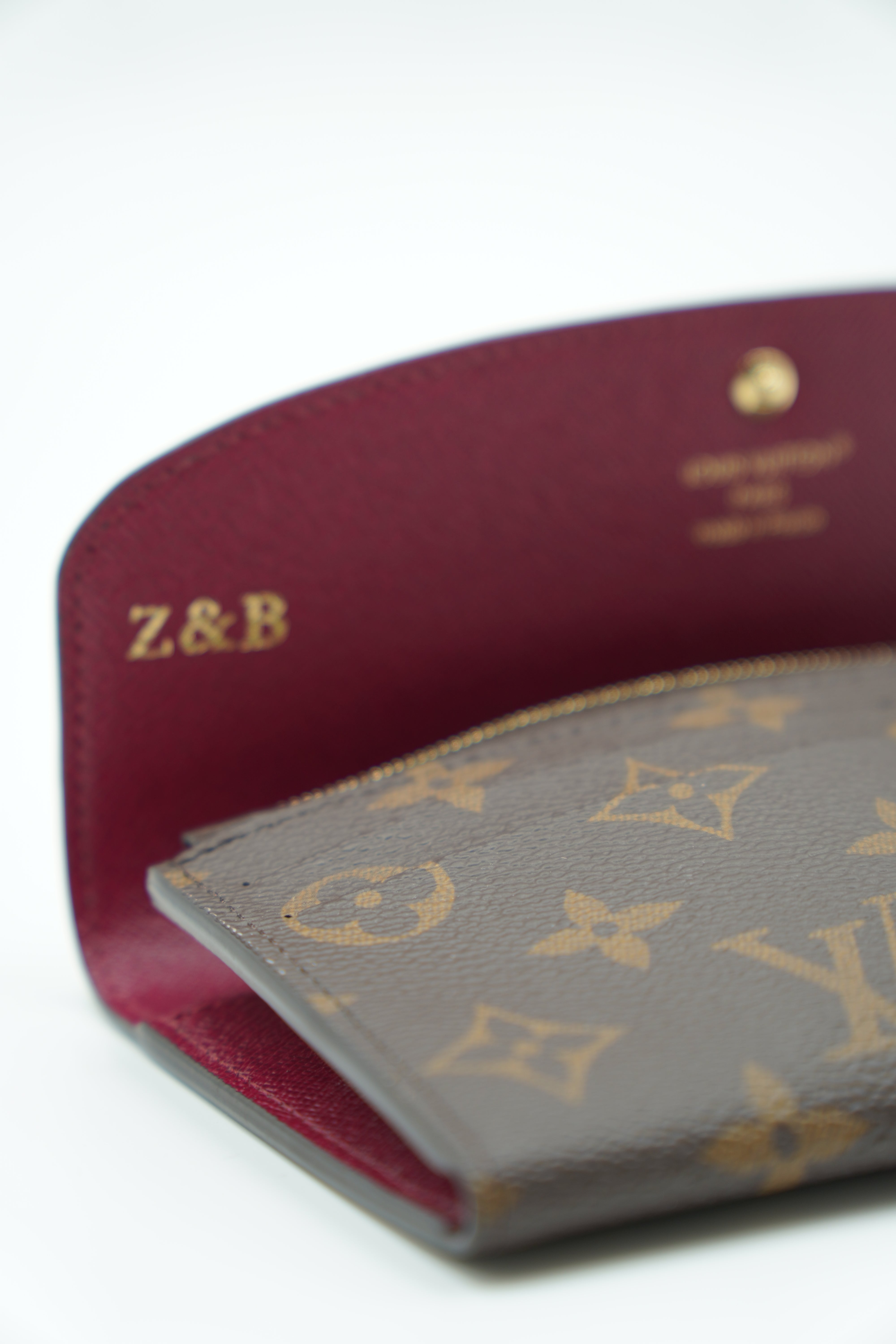 Cartera con monograma Louis Vuitton Emilie