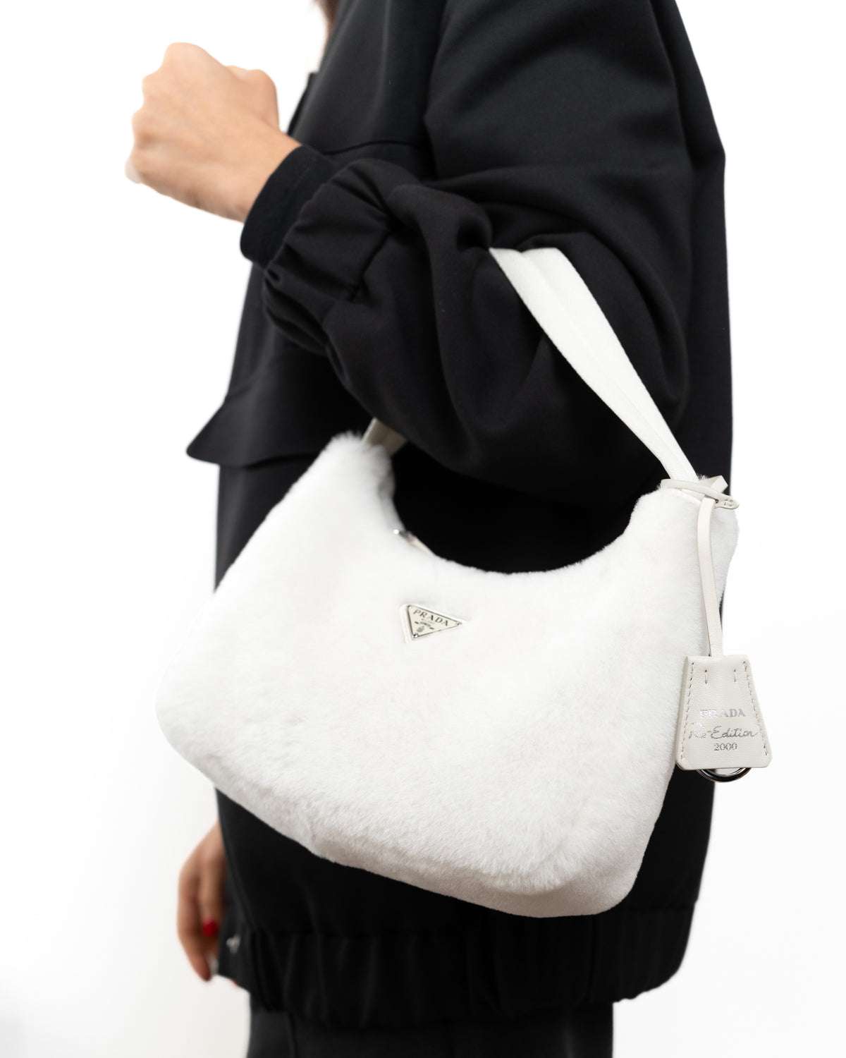 Prada Borsa Re-Edition 2000 Mini Pelliccia Bianca second hand luxury - Aurea Luxury Lab