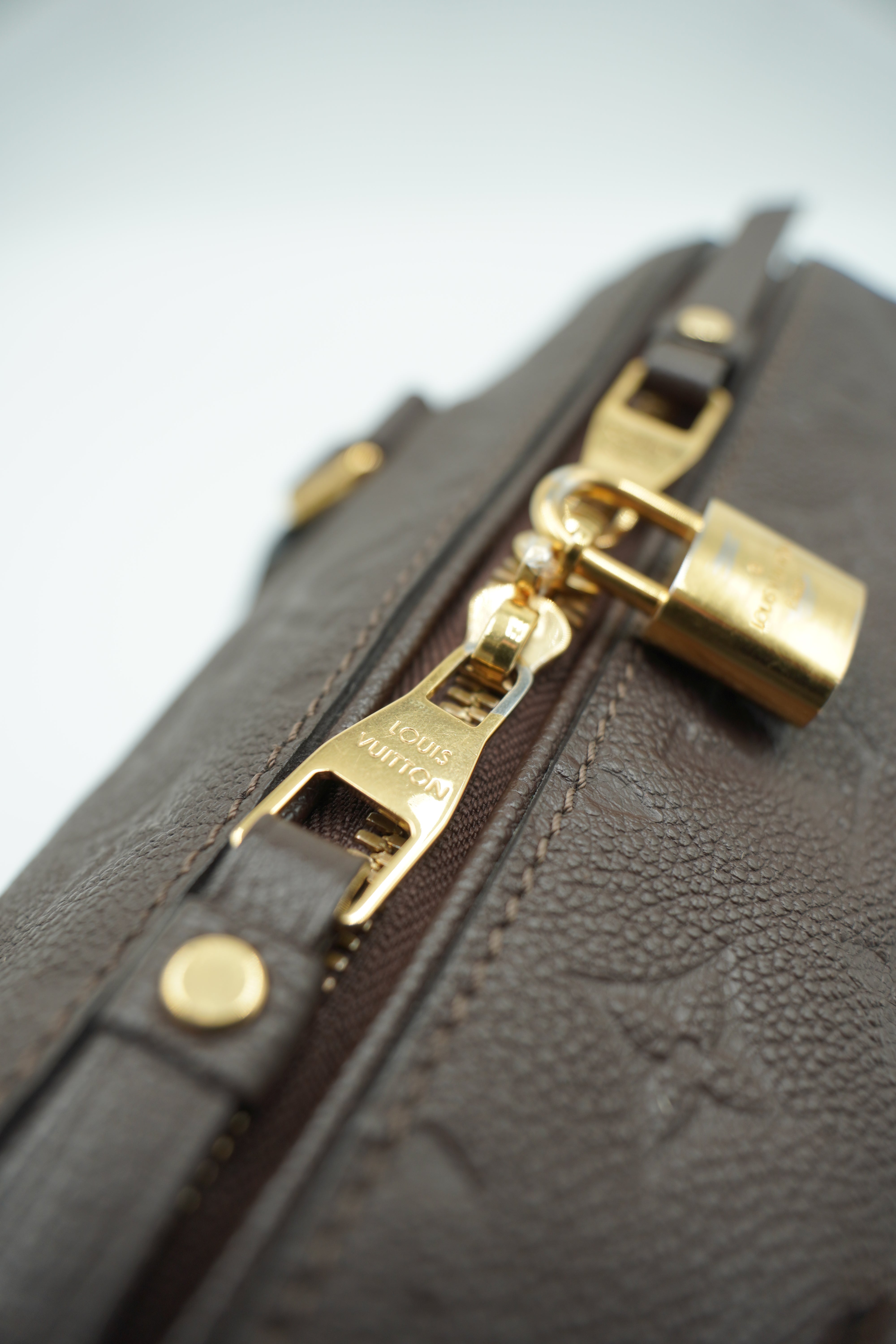 Louis Vuitton Speedy Bandoulière 25 Bolso de cuero Empreinte Monogram Castaño