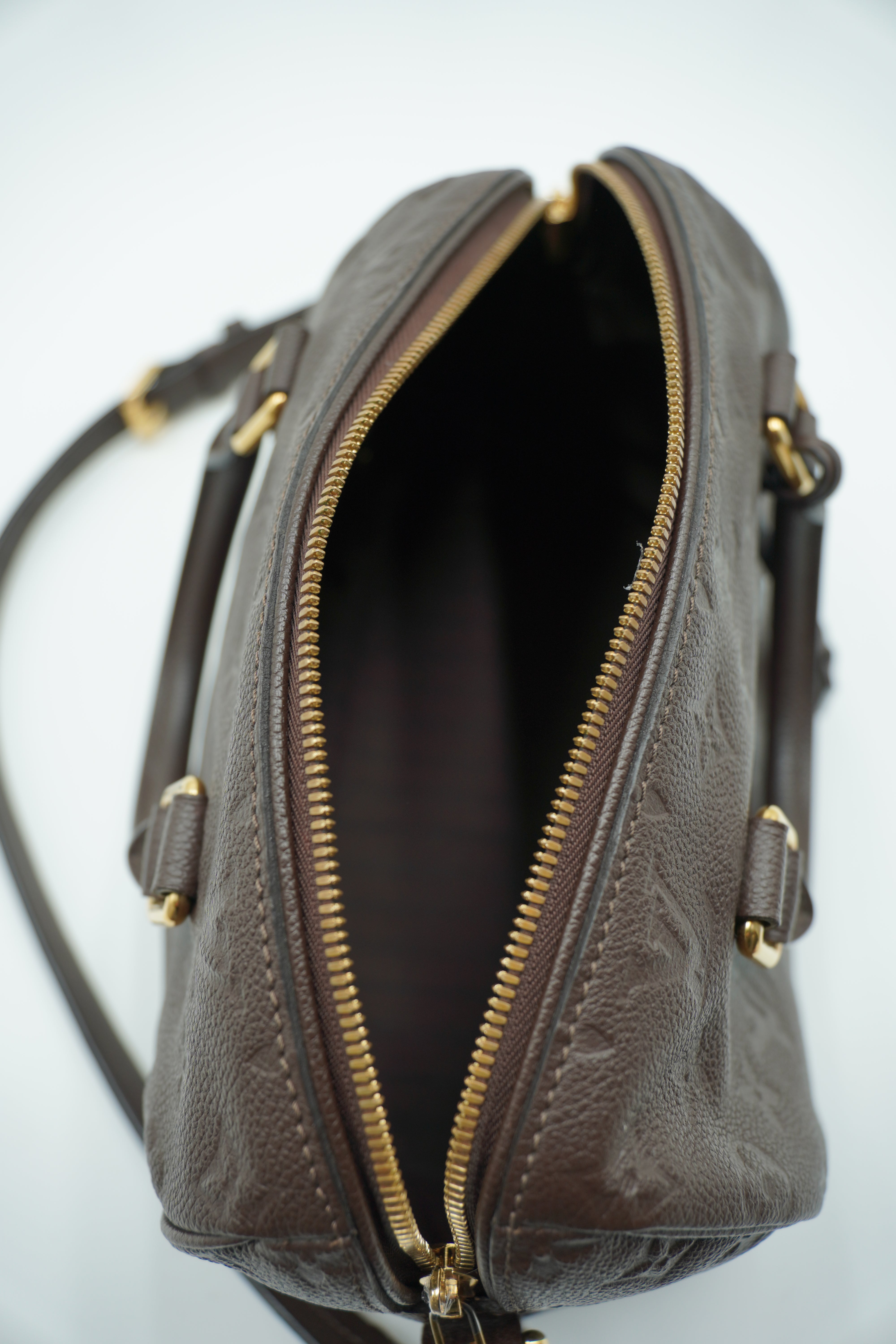 Louis Vuitton Speedy Bandoulière 25 Bolso de cuero Empreinte Monogram Castaño