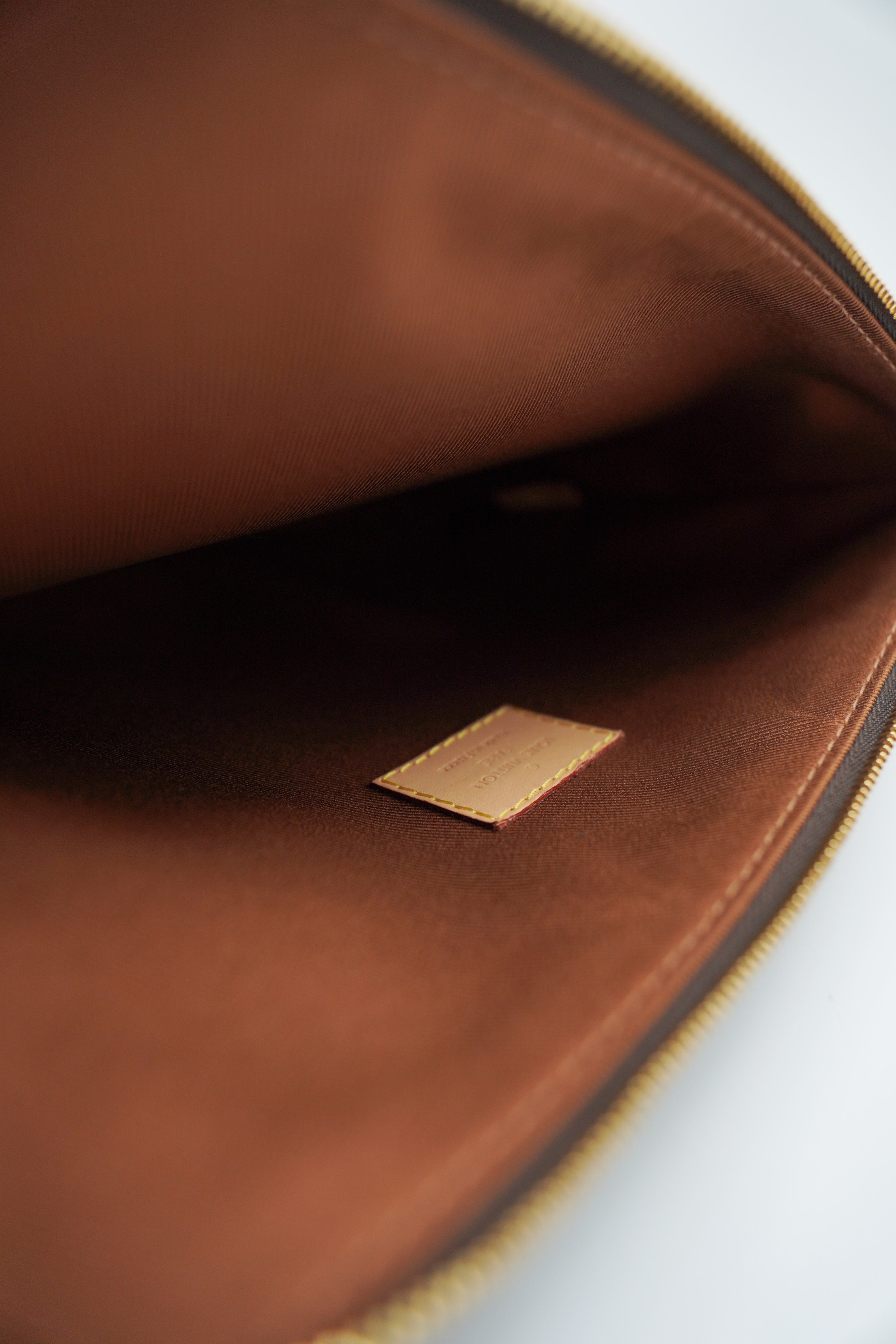Louis Vuitton Pochette Etui Monogram Voyage PM - Usato Autentico